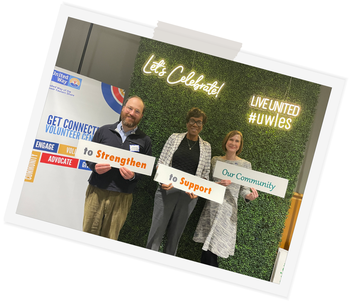 polaroid-rotated-forty-five-degrees-board-and-staff-members-hold-signs-volunteer-celebration